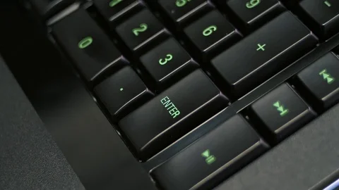 Man pressing enter key on computer keyboard Stock Footage 85402338