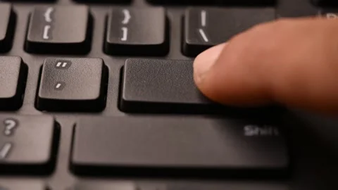 Man Pressing Enter Key on Keyboard to Confirm Input on Computer Stock Footage 333579077
