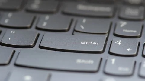 Man pressing the enter key on a modern laptop computer keyboard, macro deta.. Vídeos de archivo 307614134