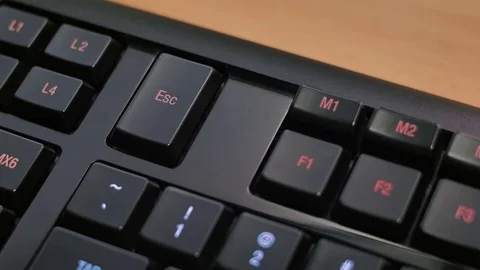 Man pressing ESC key on computer keyboard Stock Footage 85402503