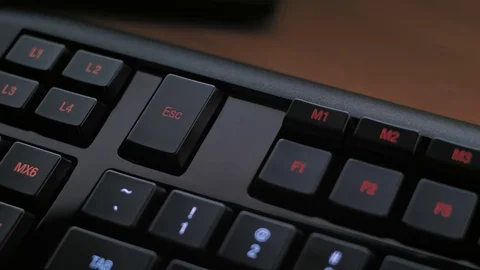 Man pressing ESC key on computer keyboard Stock Footage 85402595