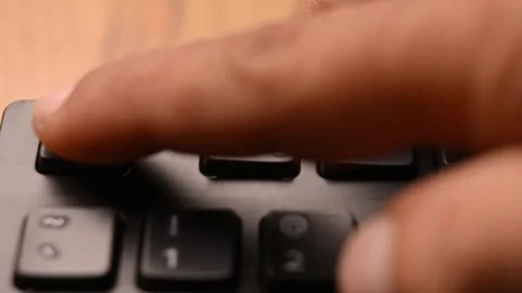Man Pressing Escape Key on Computer Keyboard in 4K 60fps Stock Footage 333571341
