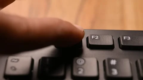 Man Pressing F1 Key on Keyboard to Open Help Menu on Computer Stock Footage 333573322
