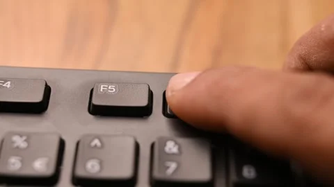 Man Pressing F6 Key on Keyboard to Navigate Address Bar on Computer Stock Footage 333570395