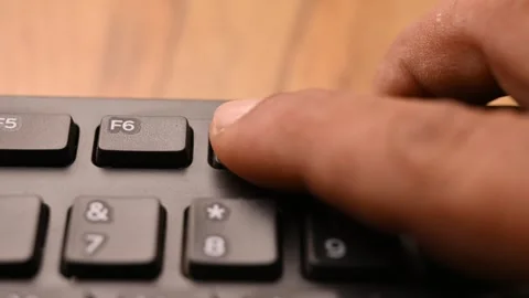 Man Pressing F7 Key on Computer Keyboard for Spell Check Function 스톡 동영상 333550943