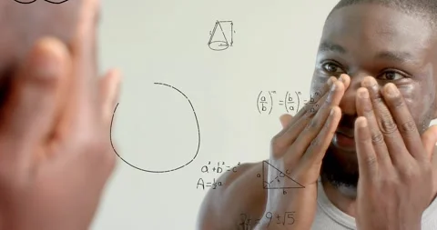 Man pressing face, viewing mirror, camera pulling back and revealing math Stock Footage 321715191