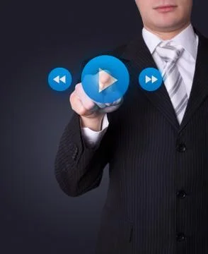 Man pressing media player button 스톡 사진