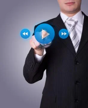 Man pressing media player button 스톡 사진