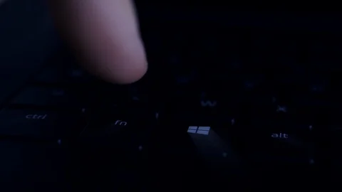 Man pressing Microsoft Windows Start button key notebook Stock Footage 120752091