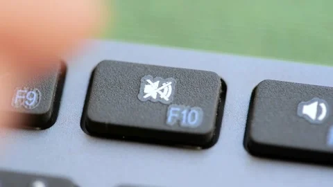 Man pressing the mute button, audio off function key on a modern computer k.. Stock Footage 225114612