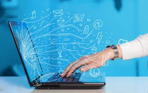 Man pressing notebook laptop computer with doodle icon cloud symbols Stock Photos