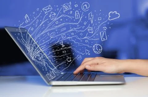 Man pressing notebook laptop computer with doodle icon cloud symbols Stock Photos