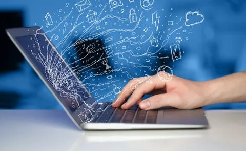 Man pressing notebook laptop computer with doodle icon cloud symbols Stock Photos