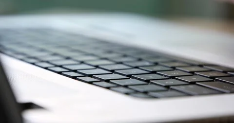 Man pressing one button on the keyboard with one finger macro close up 動画素材 133917932