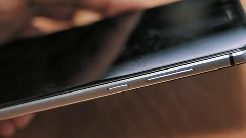 Man pressing power button on smartphone 스톡 동영상 85402326