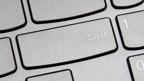 Man pressing the shift key on a modern laptop computer keyboard closeup top.. Stock Footage 307614329