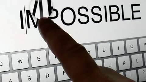 Man prints on the graphic tablet the word impossible Stock Footage 78914024