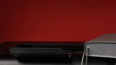 A man prints on the laser printer the first chapter of the Bible book of Exod Stock Footage 126544927