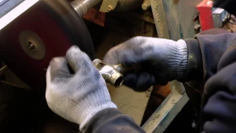 A man processes a part on a machine 库存影片 136143387