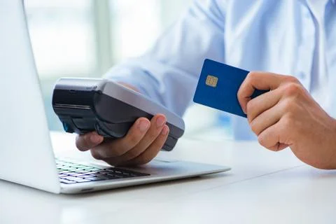 Man processing credit card transaction with POS terminal 스톡 사진