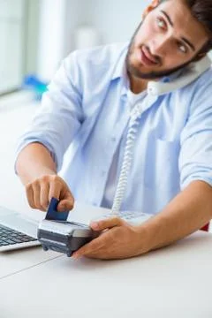 Man processing credit card transaction with POS terminal 스톡 사진