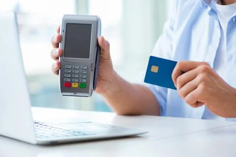 Man processing credit card transaction with POS terminal 스톡 사진