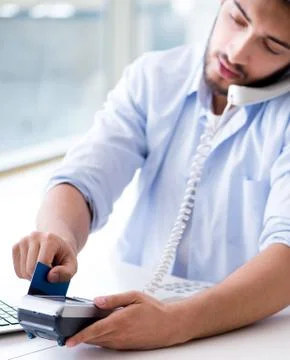 Man processing credit card transaction with POS terminal 스톡 사진