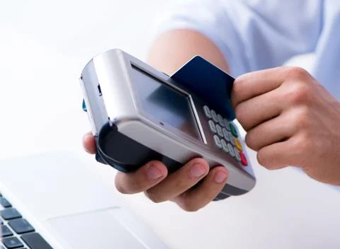 Man processing credit card transaction with POS terminal 스톡 사진