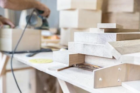 A man is processing a tree. Joiner. A carpenter. Woodworking Processes Stock Photos