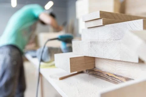 A man is processing a tree. Joiner. A carpenter. Woodworking Processes Stock Photos