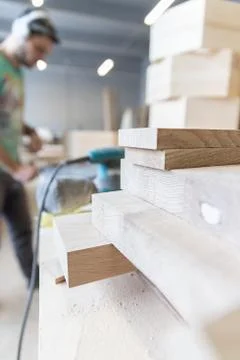 A man is processing a tree. Joiner. A carpenter. Woodworking Processes Stock Photos