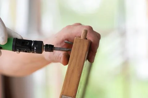 Man processing wood with tool against blurred background Stock Photos