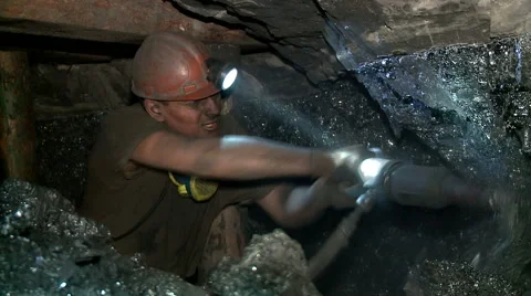 The man produces coal miner in a deep shaft Stock Footage