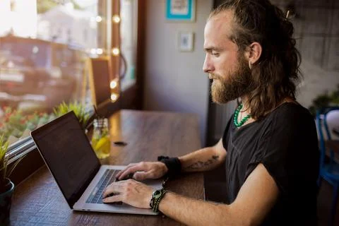 Man professional project manager checking e-mail on laptop computer while sit Stock Photos