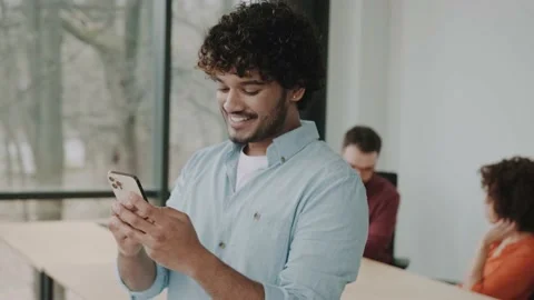 Man professional using smartphone in office. Businessman working, looking at Video stock 233904155