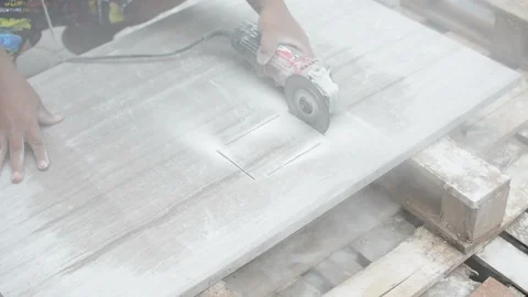 Man professional worker cutting tile with circular saw electric construction Stock Footage 114643041