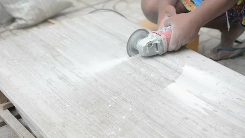 Man professional worker cutting tile with circular saw electric construction Stock Footage 114643121