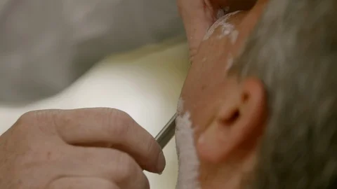 Man professionally shaved with open razor blade close-up Stock-Footage 96139306
