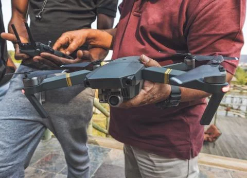 Man to program drone before taking off. Stock Photos