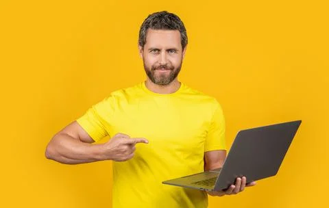Man programmer on background, point finger. man programmer in studio. Stock Photos