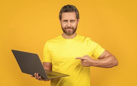 Man programmer on background, point finger. man programmer in studio. Stock Photos
