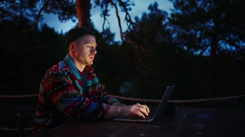 Man Programmer Or Web Designer Working Remotely From His Country House In Summer Stock Footage 257404060