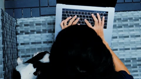 A Man is a Programmer. Typing and use Computer Laptop Working online internet 動画素材 107925321