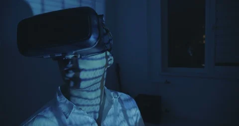 Man programmer wearing virtual reality hemlet or VR Glasses with binary code 스톡 동영상 94937060