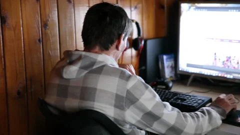 Man programmer working on computer at home coding on screen writing code Stock Footage 132062590