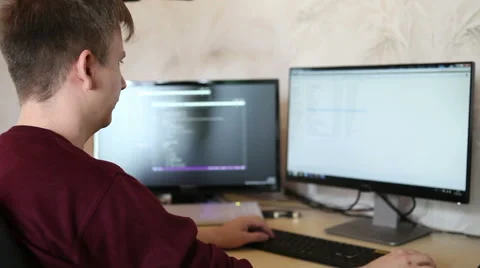 Man programmer working on a program code Vidéo 63421187