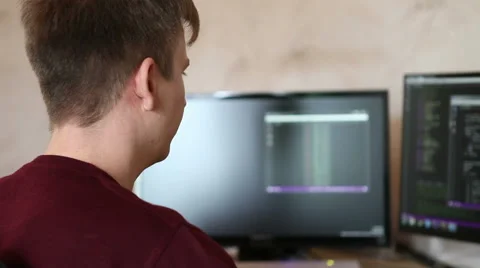 Man programmer working on a program code Stock Footage 63421189