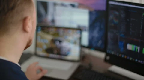 The man the programmer works behind the laptop Stock Footage 62519035