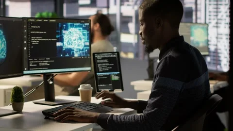 Man programming in office using artificial intelligence tech Stock Footage 318237356