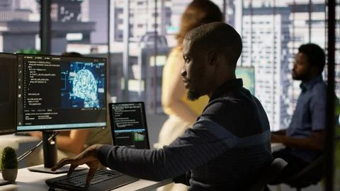 Man programming in office using artificial intelligence tech 写真素材